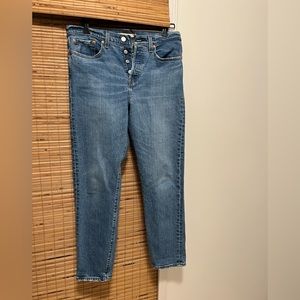 Levi’s Wedgie 99% cotton tapered leg.